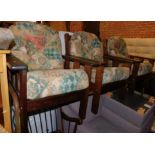Three teak garden chairs, with floral seat cushions. The upholstery in this lot does not comply with