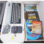 An Oric-1 personal computer together with a basic programming manual, sixty programmes for the