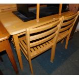 A beech kitchen table, 75cm high, 114cm wide, 70cm deep., and four ladder back chairs. (5)