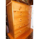 A pine chest of two over four drawers, 89cm high, 82cm wide, 37cm deep.