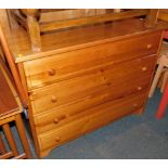 A pine chest of four long drawers, raised on bracket feet, 74cm high, 96cm wide, 51cm deep.