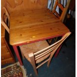 A pine square kitchen table, 75cm high, 73cm wide, 73cm deep., together with three associated rush