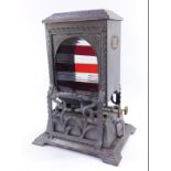 A Wright & Butler patent "Cheerful" petroleum stove, Birmingham, with cast foliate decoration, front