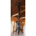 An ebonised bent wood hat and coat stand, 181cm high.