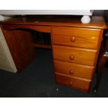 A pine dressing table, with four drawers, 76cm high, 106cm wide, 49cm deep.