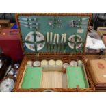 A Sirram picnic hamper, for six place settings, with plates, cutlery, cups and storage containers,