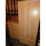 An Alston's beech effect chest of drawers, 105cm high, 102cm wide, 41cm deep., a two door