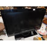 An LG 32 inch colour television, model no. 32LC56-ZC, with remote.