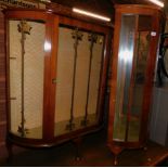 A mid 20thC walnut china cabinet, 107cm high, 91cm wide, 30cm deep., together with another smaller