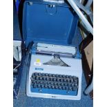 An Erika typewriter, cased.