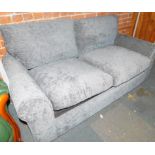 A two seater sofa bed, upholstered in silver blue chenille.