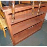 A stained pine bookcase, enclosing two fixed shelves, 97cm high, 122cm wide, 27cm deep.