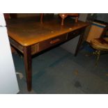 An Abbess oak and oak veneered desk, with two drawers, label inside drawer, 76cm high, 137cm wide,