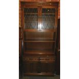 An oak Old Charm style bookcase cabinet, with lower drawers and cupboards, 204cm high, 92cm wide,