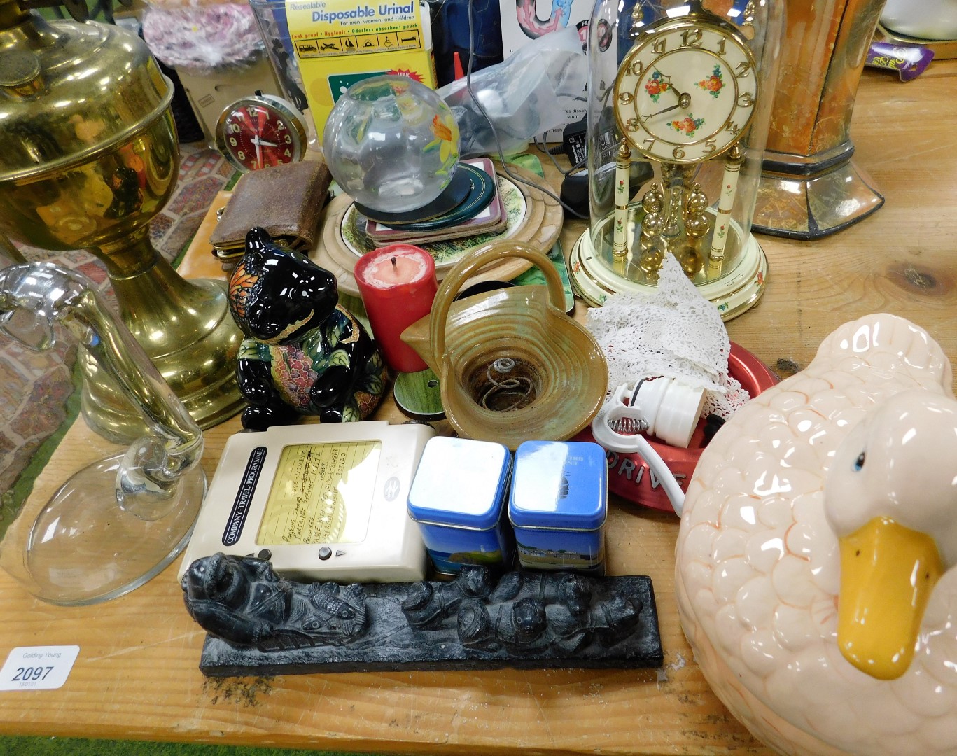 A quantity of ornaments and trinkets, to include a brass oil lamp, posters, two orange urnular - Image 3 of 3