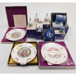 A group of boxed Wedgwood bells and trinket dishes, together with three collectors plates.