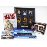 Various Star Wars collectables, a Darth Maul Rubik's cube puzzle, blister pack, film cell, Episode