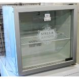 A Stella Artois table top bottle fridge, by Husky in silver, 50cm high, 50cm wide, 45cm deep.