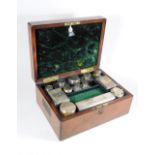 A Victorian burr walnut ladies travelling toilet case, with inlaid brass cartouche to the hinged lid