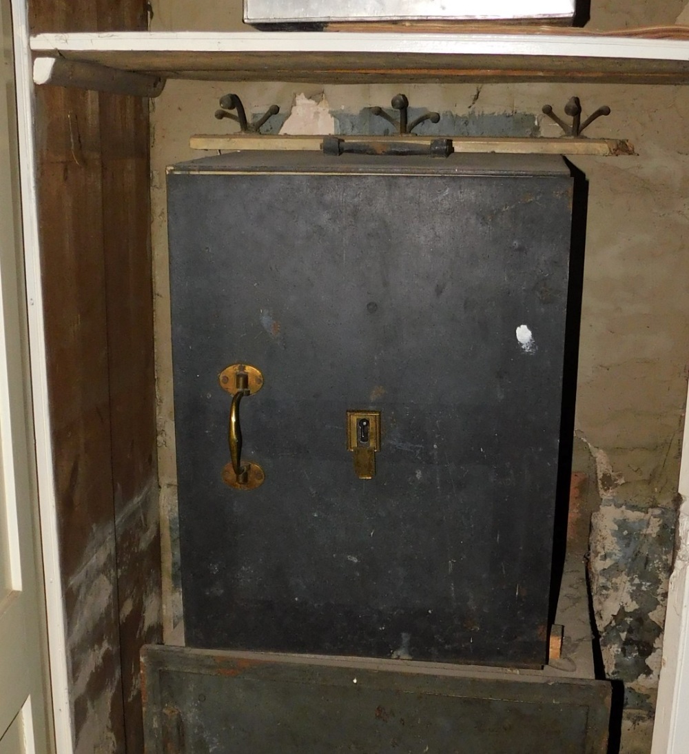 A late 19th/early 20thC safe, with brass handles and escutcheons, unmarked, 64cm high, 49cm wide.