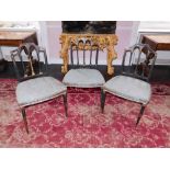 A set of three George III painted side chairs, each decorated in gilt with swags, patera, etc, on