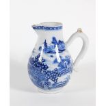 An early 19thC Chinese blue and white porcelain milk jug, with loop handle and sparrow beak spout,