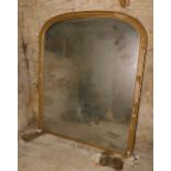 A Victorian gilt plaster overmantel mirror, with arched rectangular plate, 158cm high, 138cm wide.