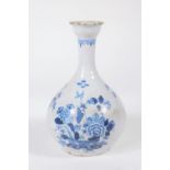 An English Delft guglet vase, c1760, decorated in blue and white, with a basket of flowers, 22cm
