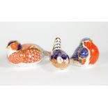 Three Royal Crown Derby paperweights, including robin and pheasant.