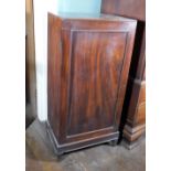 An early 19thC mahogany folio cabinet, the top with a moulded edge and a single panelled door