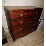 An early 19thC mahogany chest, of two short and three long graduated drawers, with brass handles,