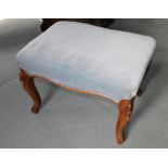 A Victorian walnut stool, with powder blue upholstered padded seat on carved cabriole legs, 64cm