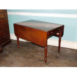 A early Victorian mahogany Pembroke table, the rectangular top with rounded corners above a frieze