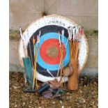 A Jaques archery target and a collection of arrows, quiver and accessories.