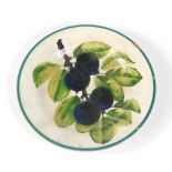 A Wemyss pottery small plate, c1900, decorated with damsons within a green line border, impressed