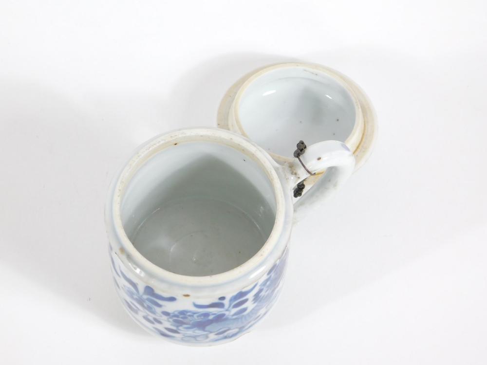 A 18thC Chinese pot and cover, of cylindrical form with blue and white floral decoration, 9cm high. - Image 3 of 4