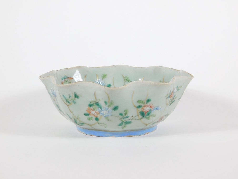 A 19thC celadon glazed Chinese porcelain bowl enamelled with peony branches, with wavy edge and - Image 3 of 4