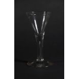An 18thC wine glass, with trumpet bowl and tapered air stem, 16.9cm high.