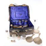 A collection of silver backed ladies dressing table accoutrements, including three hand mirrors,