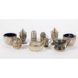 A collection of various silver condiments pieces, including a pair of Victorian circular salts,