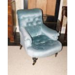 A Victorian upholstered low armchair in the manner of Howard and Sons, with a powder blue velvet