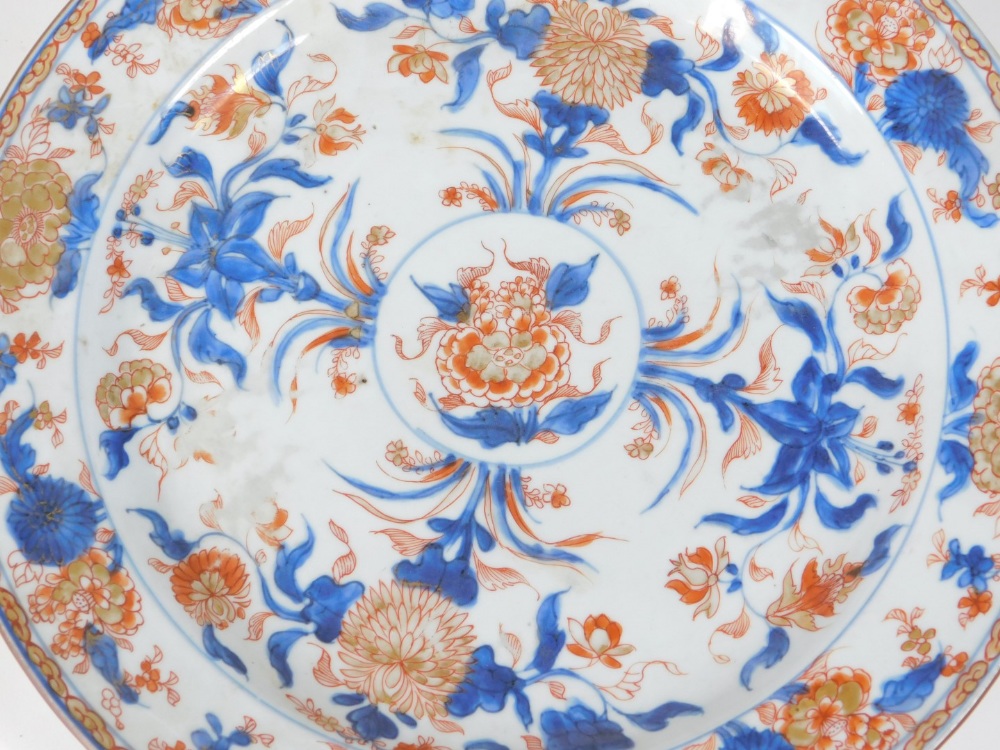 A 18thC Chinese platter, decorated in polychrome with a circular floral landscape, 32cm diameter, - Image 2 of 4