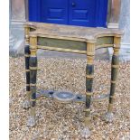 A Regency gilt and ebonised console or pier table in the manner of George Smith, the shaped top to