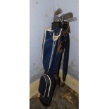 A golf club and golf bags, including three Slazenger irons, a Dunlop putter, and others.