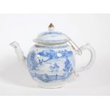 An 18thC Chinese blue and white porcelain bullet shaped teapot and cover, with rustic handle and