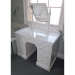 A Victorian painted dressing table, the rectangular plate on turned supports, the kneehole base with