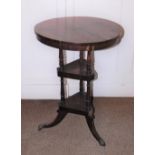 A early Victorian rosewood washstand, the circular top above two triangle undertiers, each with