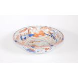 An 18thC Chinese porcelain bowl, with landscape and fisherman in central reserve in Imari colours,