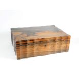 A 19thC Ceylonese coromandel wood shaped rectangular work box, with hinged lid, having serpentine