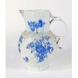 A Worcester blue and white cabbage leaf mask jug, c1780, decorated with floral sprays, 'C' marked,